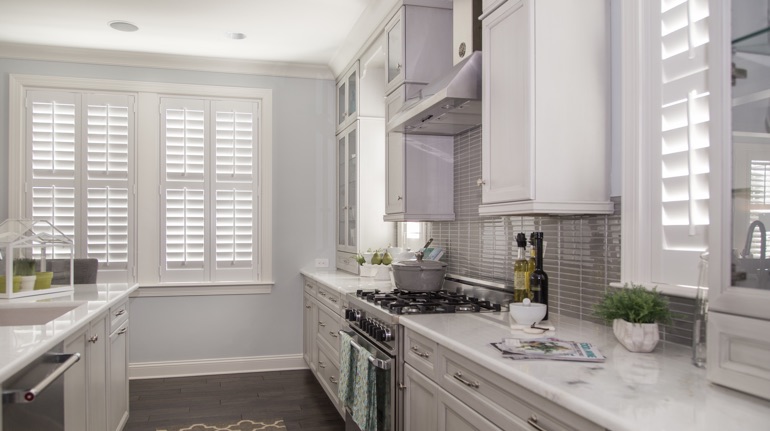 White shutters in Charlotte kitchen with modern appliances.